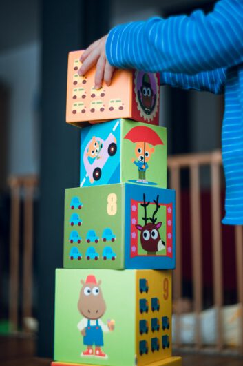 pexels-photo-298825-298825 Person Holding Yellow and Pink Lego Blocks